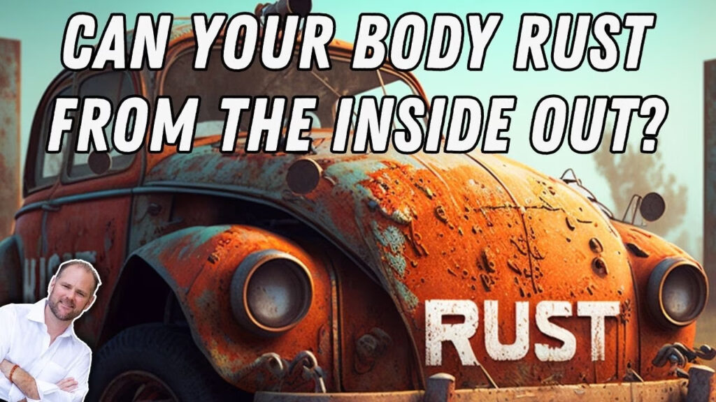Rusted vintage car with healthcare professional discussing iron overload causing cellular oxidative damage and chronic inflammation