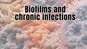 Microscopic view of bacterial biofilms showing clustered microorganisms in protective matrix formations