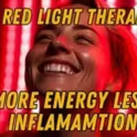 Smiling woman in front of red light therapy panel highlighting its benefits for energy and inflammation reduction.