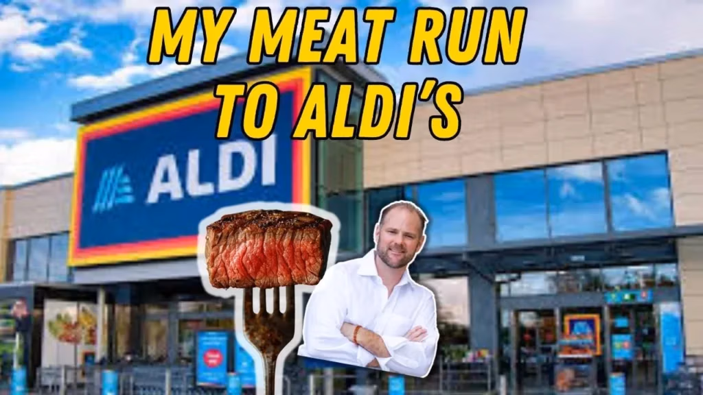 Shopping cart filled with Aldi groceries including Black Angus beef, ribeye steaks, berries, and keto snacks for a carnivore diet.