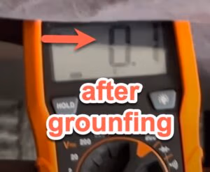 Voltage meter showing a reading of -22.3 mV after a grounding session, demonstrating the body's shift to a negative electrical potential.