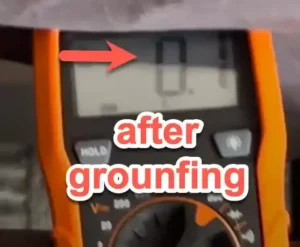 Voltage meter showing a reading of -22.3 mV after a grounding session, demonstrating the body's shift to a negative electrical potential.