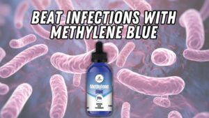 Methylene Blue bottle and red light therapy device for natural infection treatment.