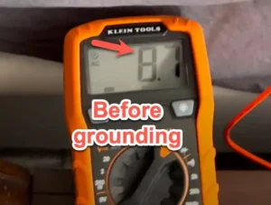 Voltage meter showing a reading of +1.6 volts before grounding, indicating the body's positive electrical charge when disconnected from the Earth.