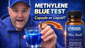 Dr. Hugh Wegwerth demonstrating methylene blue supplement capsules versus liquid while explaining functional medicine approaches to cellular health
